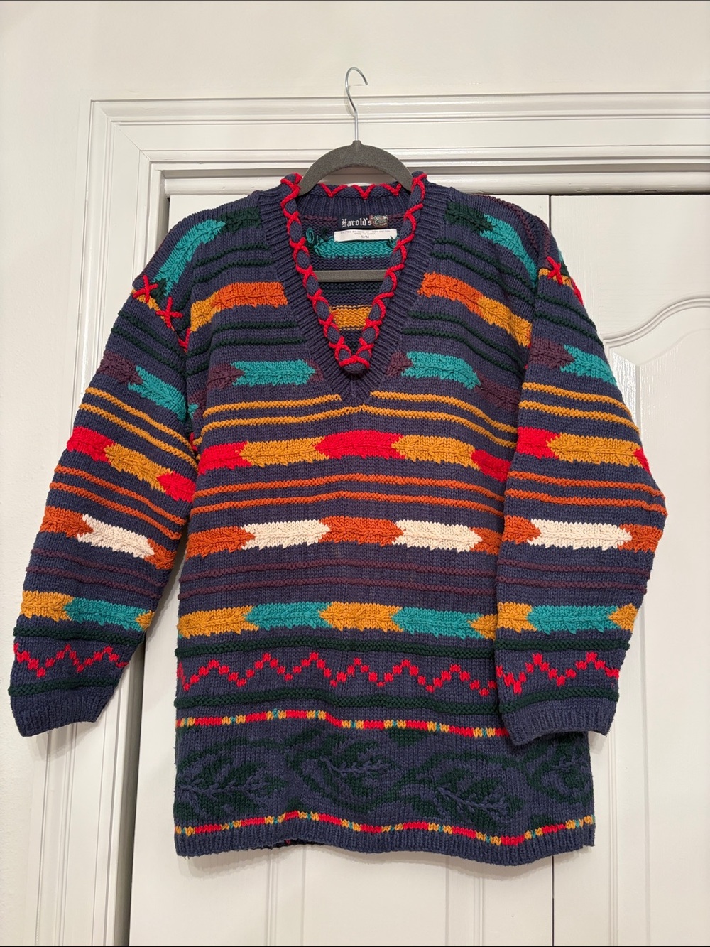 Harold's Navy V-Neck Sweater with Multicolor Stripes